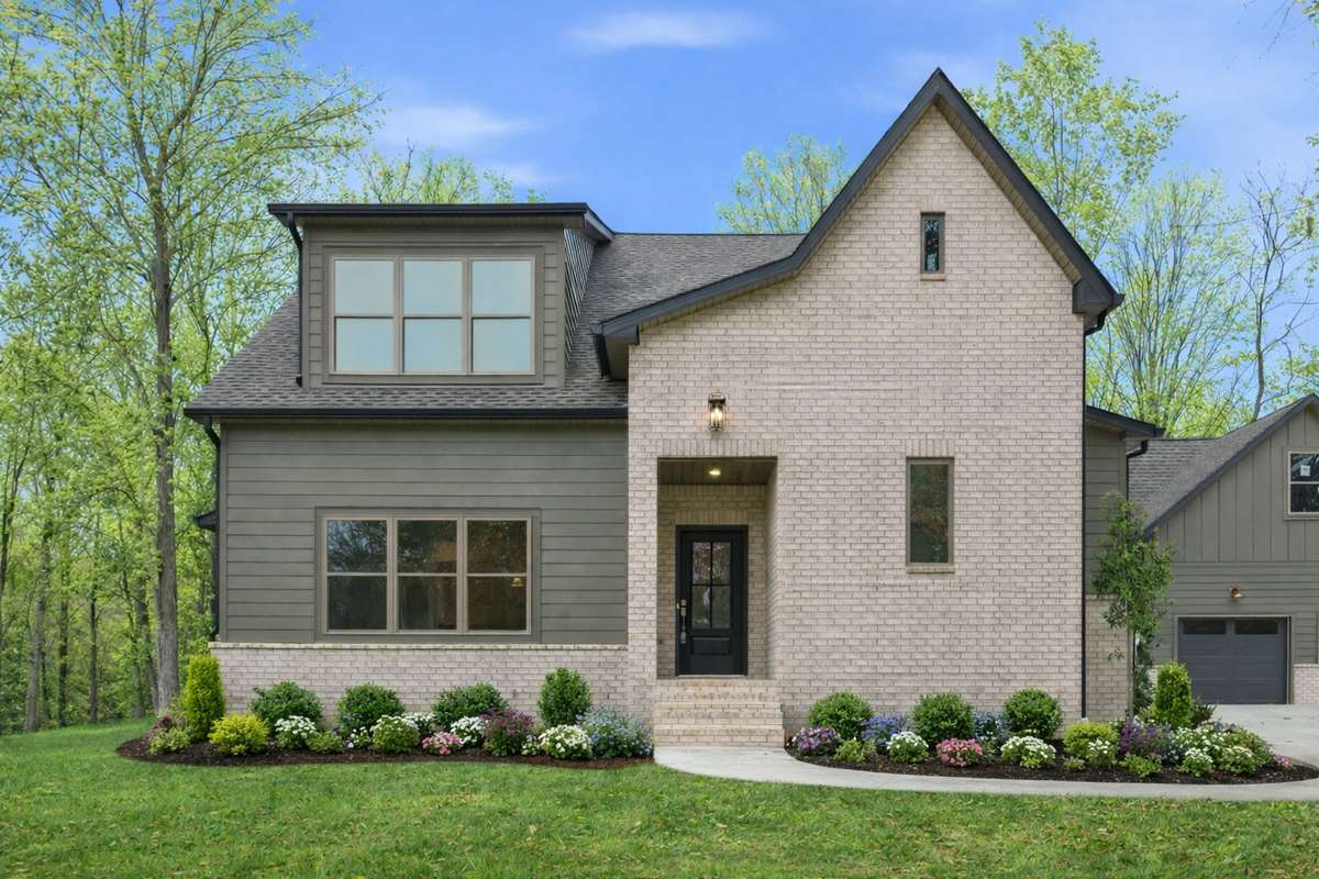 This image has been thoughtfully enhanced to illustrate the home in a spring setting, with added landscaping to inspire its full potential.  Landscaping and foliage may not reflect current conditions.