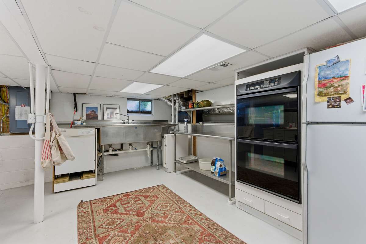 Basement: The full basement has been used as a catering kitchen, a library, an office, and an artisan craft zone.