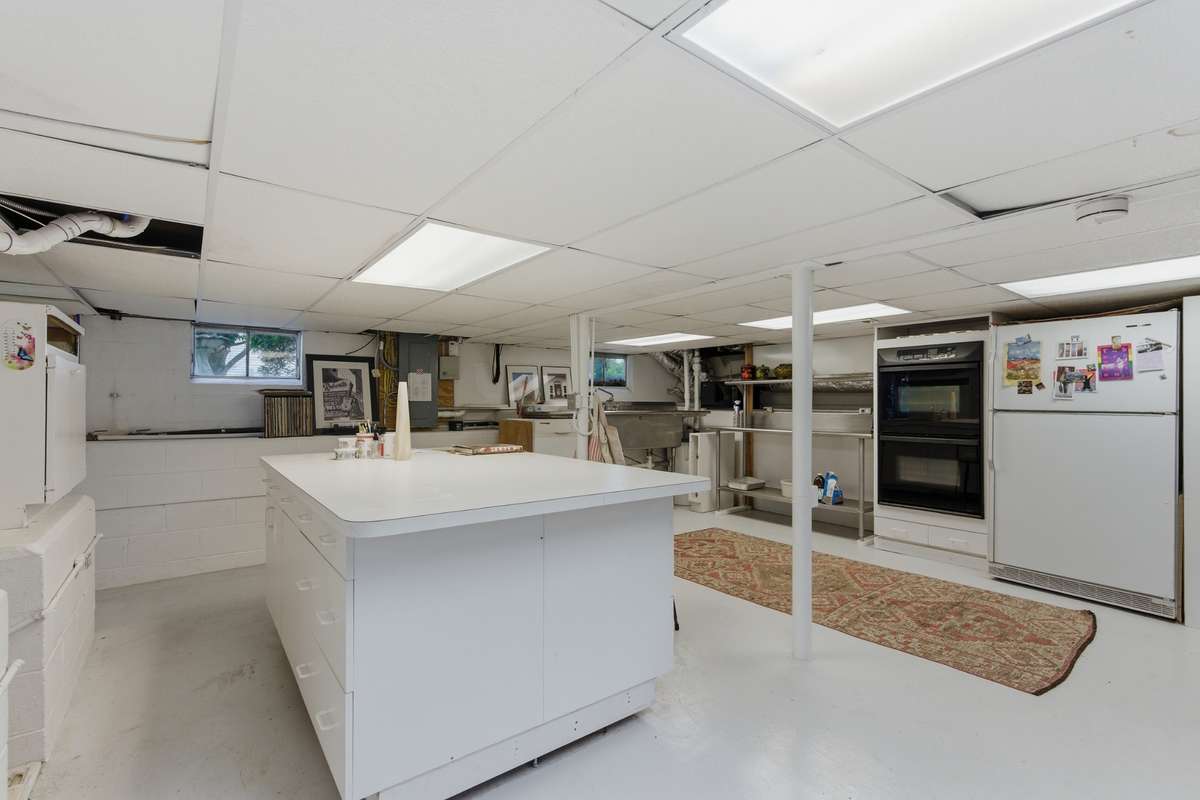 Basement: The full basement has been used as a catering kitchen, a library, an office, and an artisan craft zone.