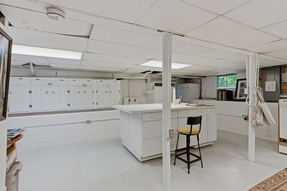 Basement: The full basement has been used as a catering kitchen, a library, an office, and an artisan craft zone.