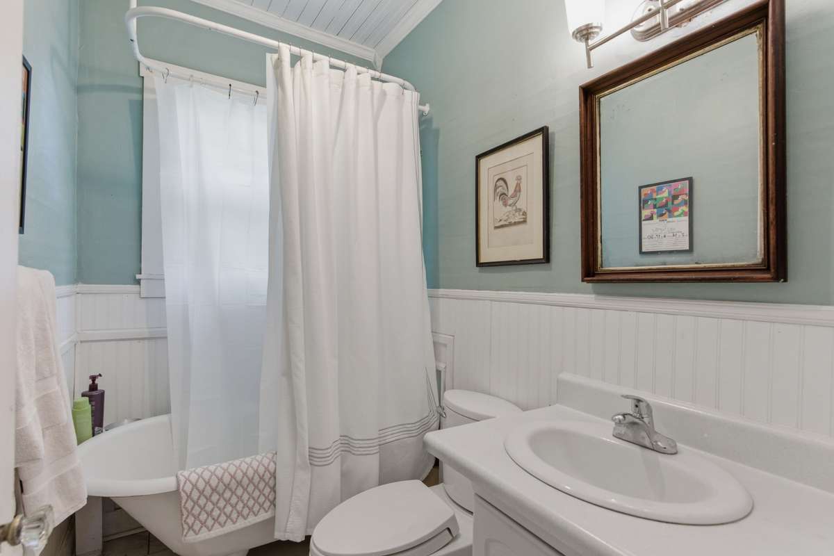 Full bathroom complete with a soaker tub.