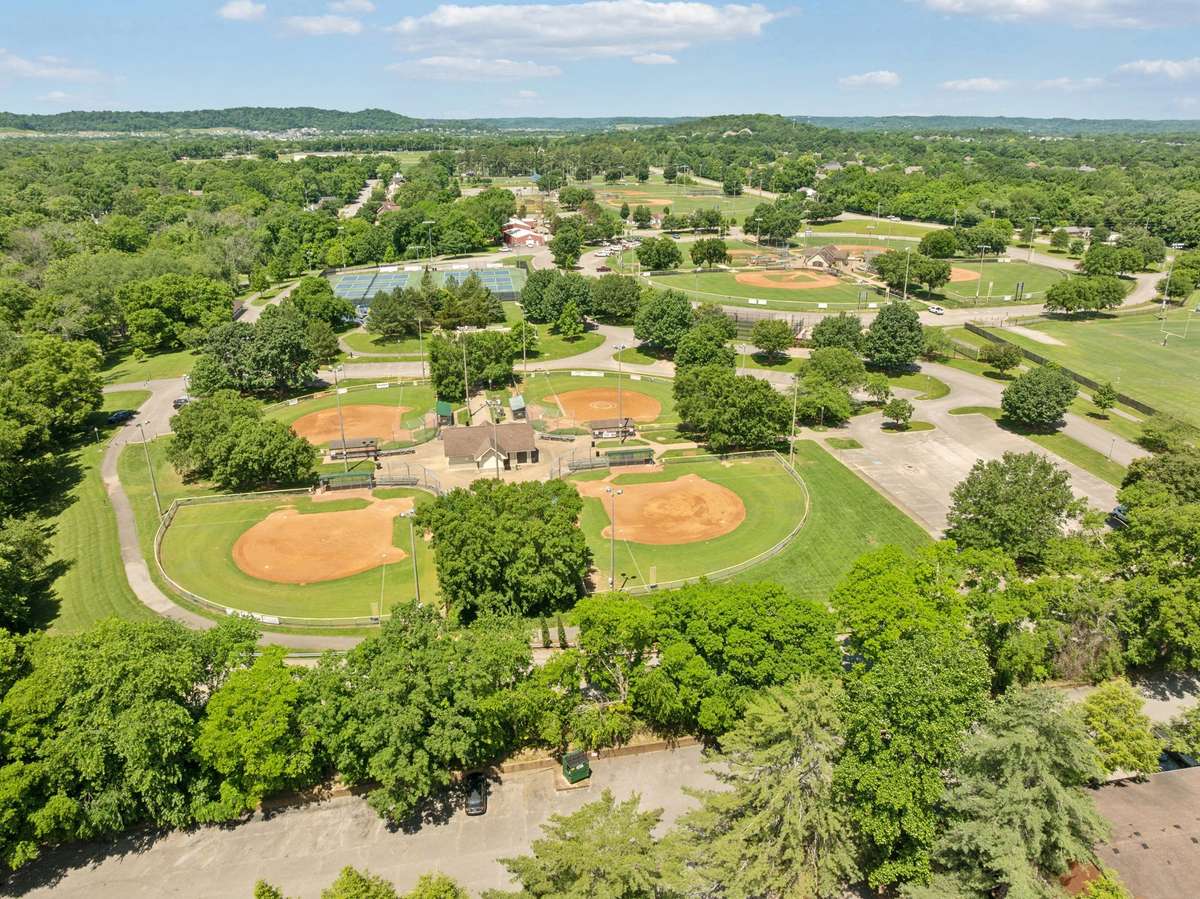 View of Jim Warren Park. 2.5 miles of walking trails, tennis courts, baseball and football fields, pond and picnic area and skate park,