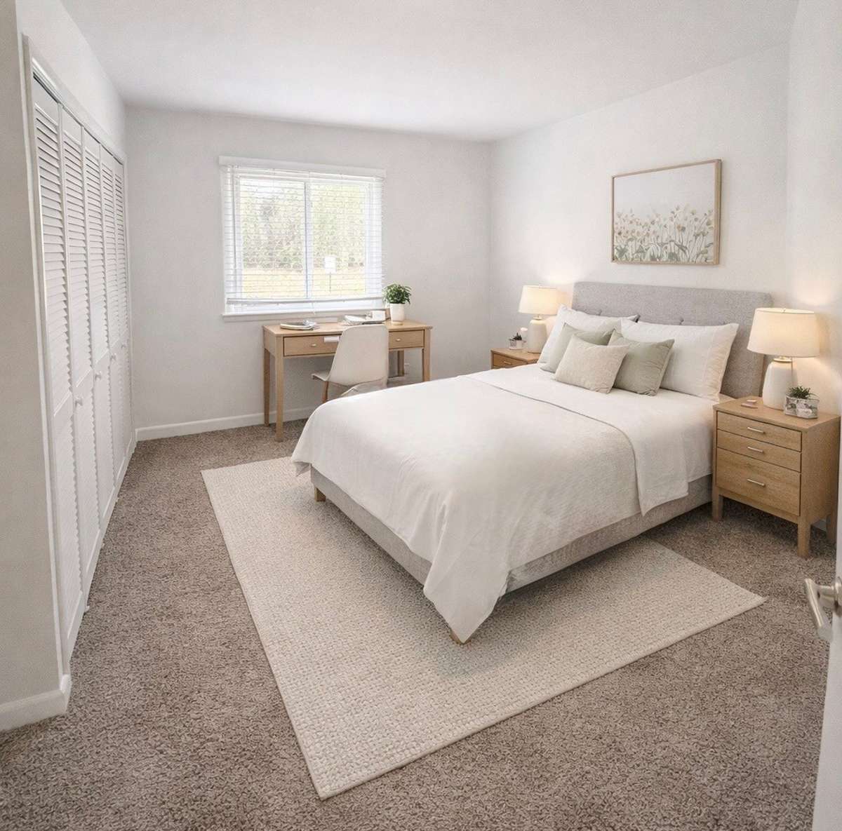 Second bedroom with blind on window. Closet to the left is laundry closet with washer and dryer.