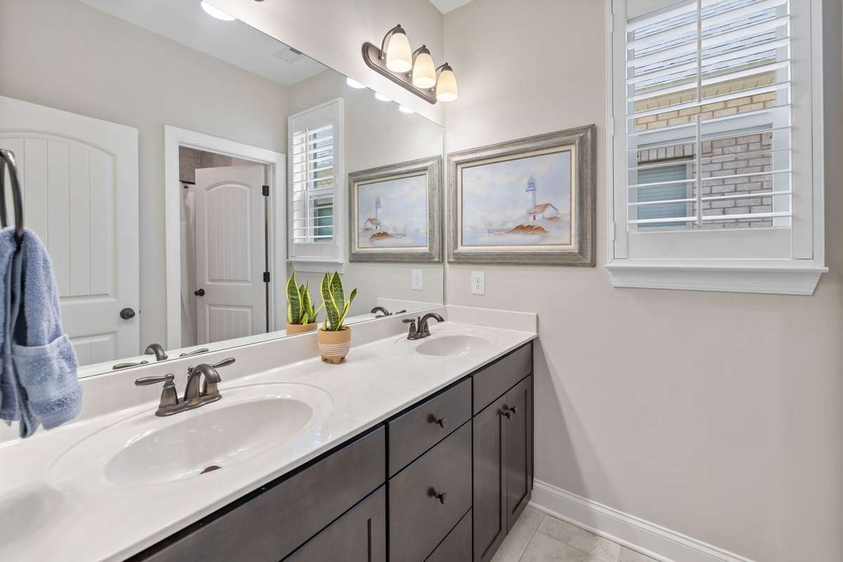 Second full bath with double sink/vanity.  Shower/tub combo in private separate area.  Allows privacy and convenience.