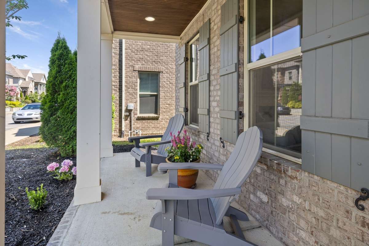 This home has a romantic double-balcony.  Relax on either of two front porches - one downstairs and a romantic balcony/porch upstairs, just of the Primary Suite on the front of the home. Perfect for Coffee in the morning or Ice Tea at night.