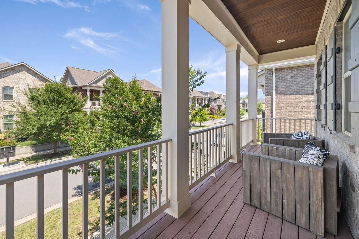 The front of the home offers a front balcony, accessed from the Primary Bedroom.  Perfect for coffee and a book - at any time of day!!!