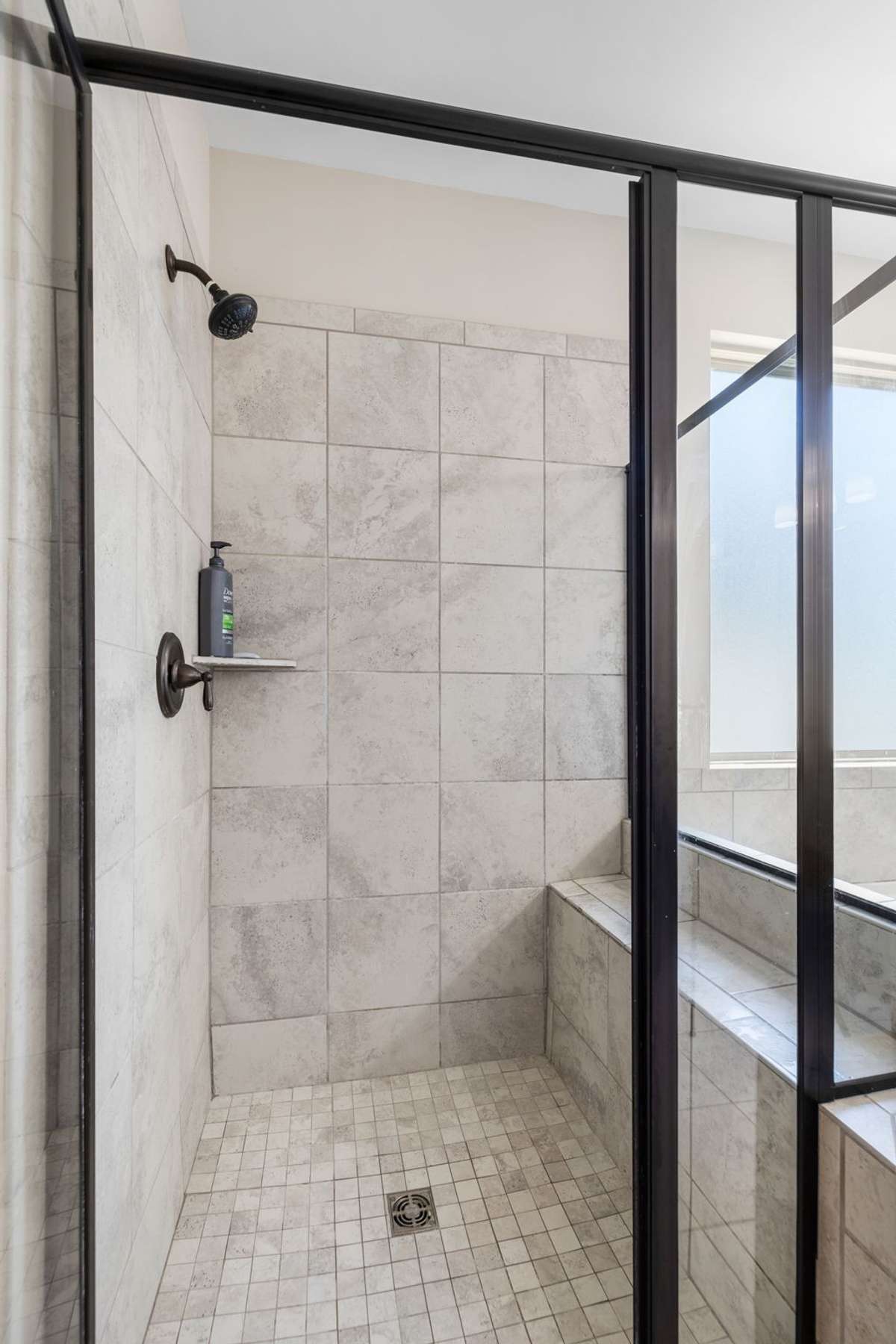 Glass door shower and tile seating bench.  Time for relaxing!