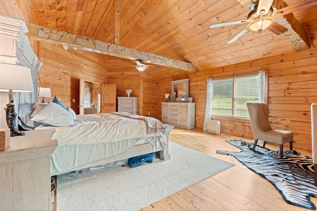 Oversized suite accommodates large furniture pieces and sawn beams add character.