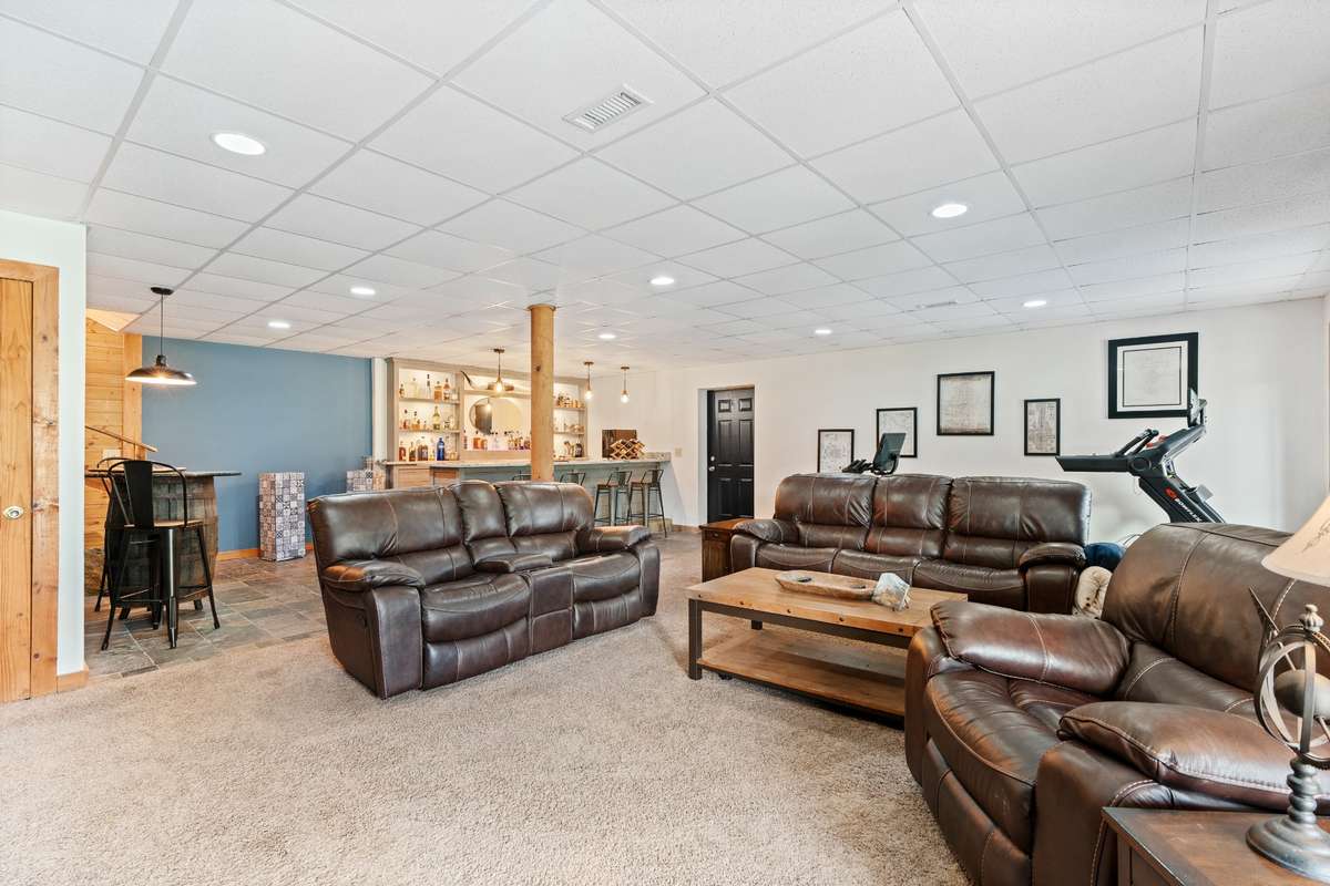 Large living room area with easy access to patio and pool area
