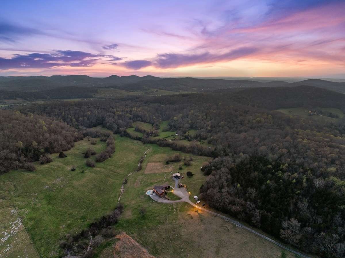 Mix of cleared, planted, and wooded acreage.