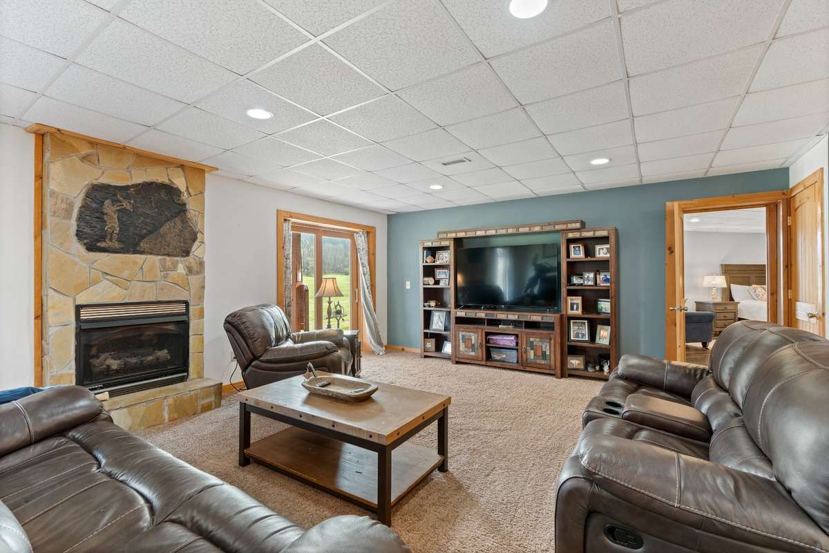 Basement Lower level bedroom is tucked behind the living room area.