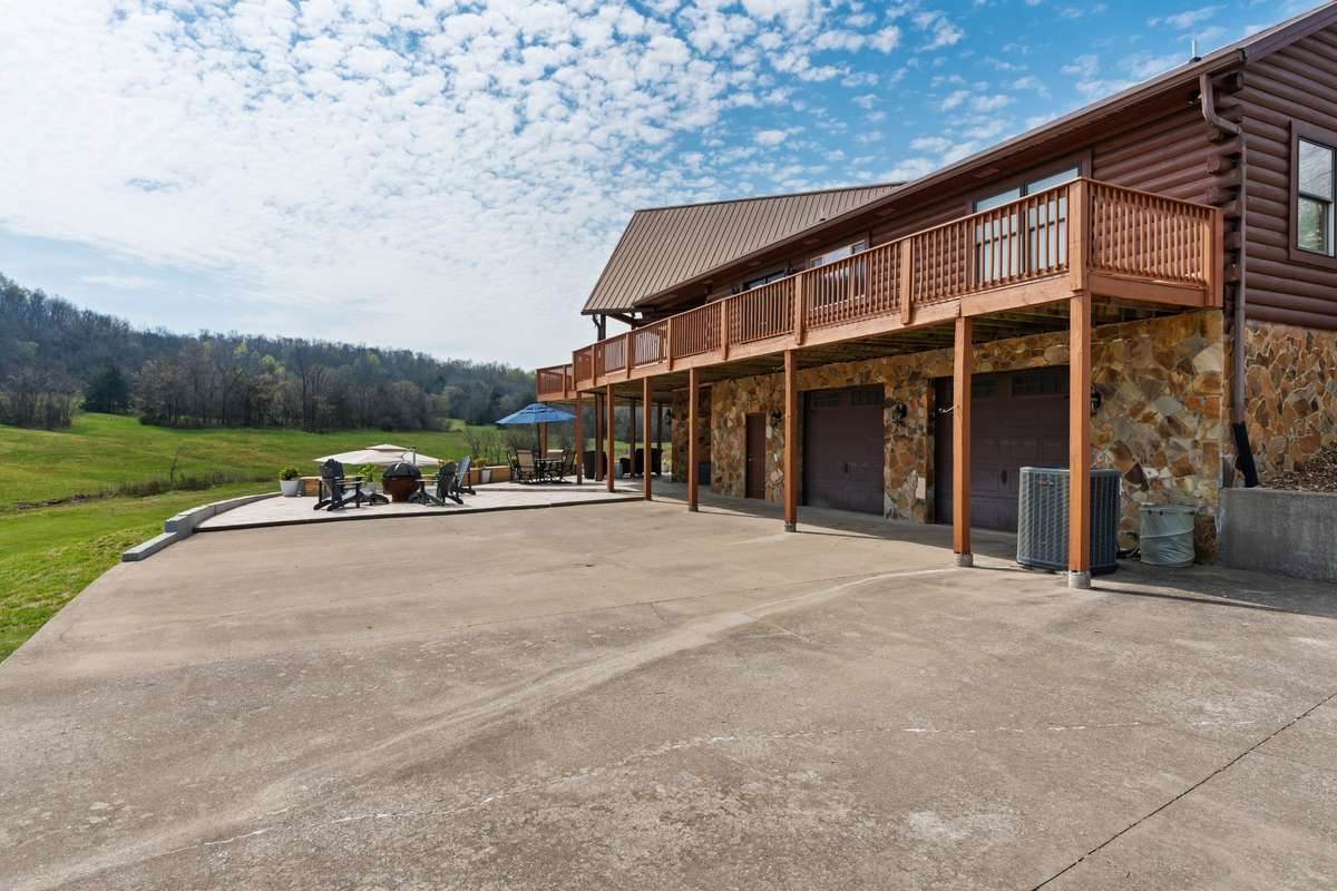 Pull in garage extended bays and large side parking pads.