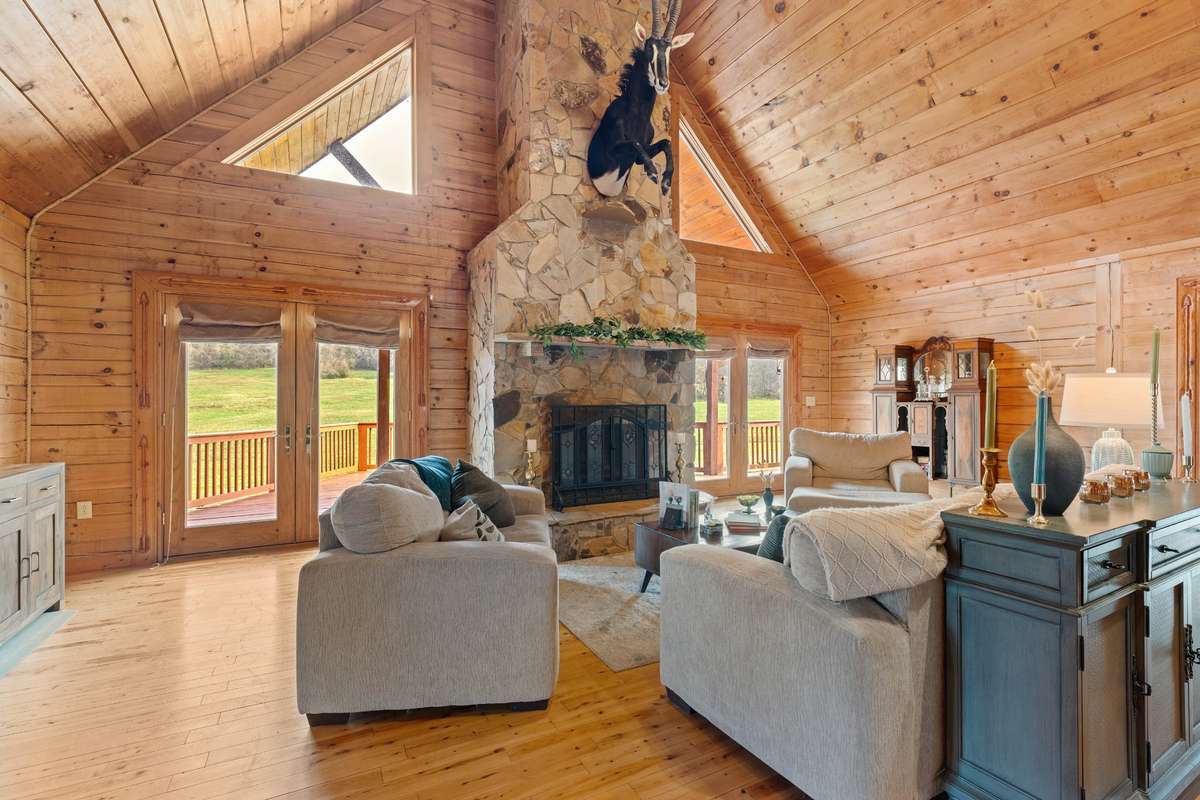 Soaring ceilings bring in outside light for an airy cabin feel.