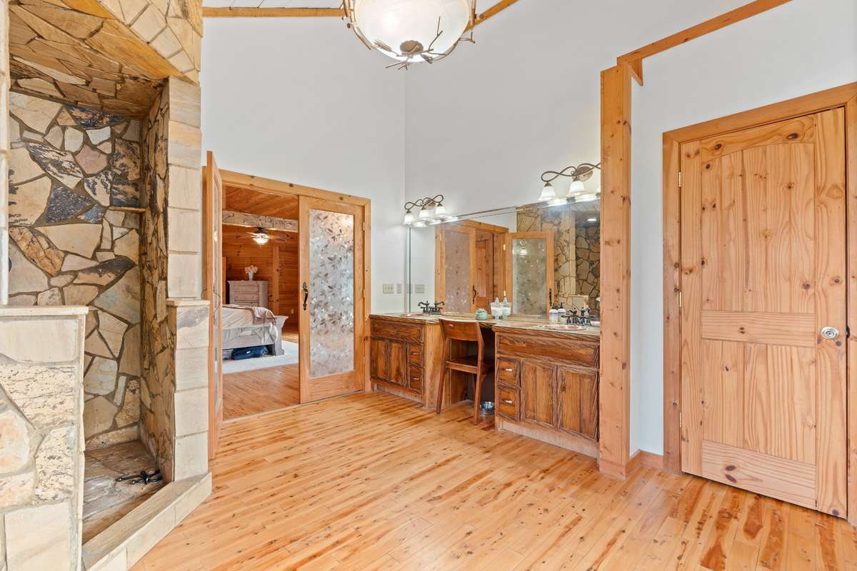 Primary bathroom complete with double vanities, walk in shower and jacuzzi tub.
