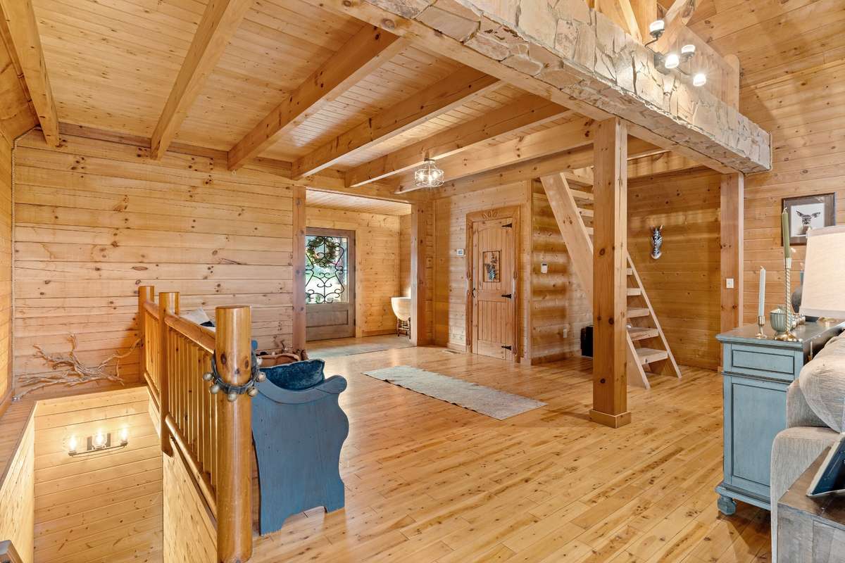 Main level living area has a half bath and access to the basement just off the entry way.