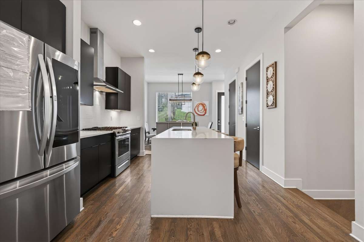On this level, you’ll find a convenient pantry and a stylish half bath—perfect for everyday use and added functionality.