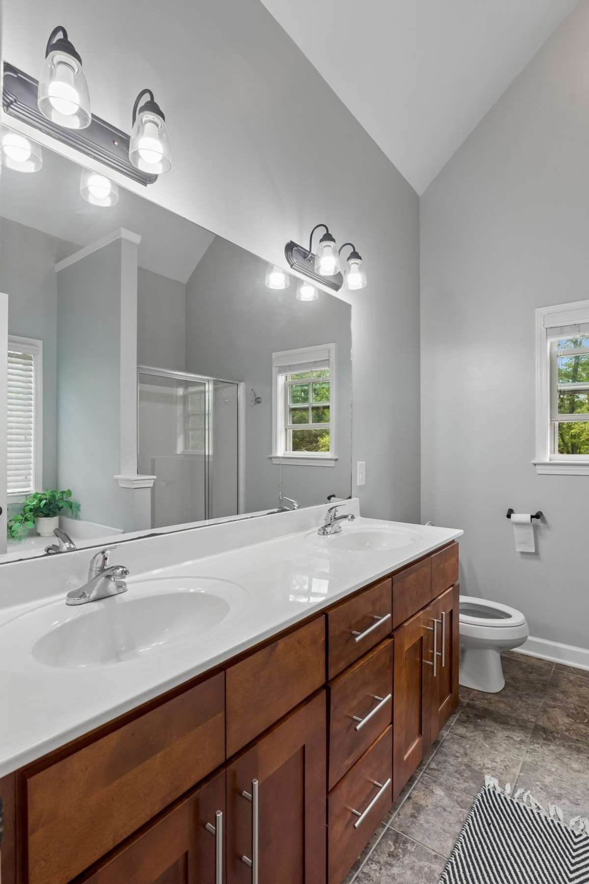 Primary bath with oversized double vanity & vaulted ceiling. 1012 Rudder Drive, Spring Hill, TN 37174