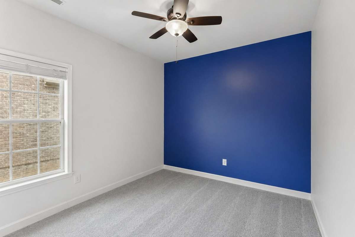 Office or potential fourth bedroom with ceiling fan & carpet floors. 1012 Rudder Drive, Spring Hill, TN 37174