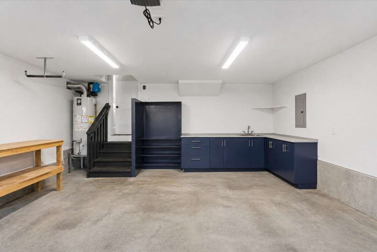 Another view of your spacious garage with hall tree, cabinets & sink! 1012 Rudder Drive, Spring Hill, TN 37174