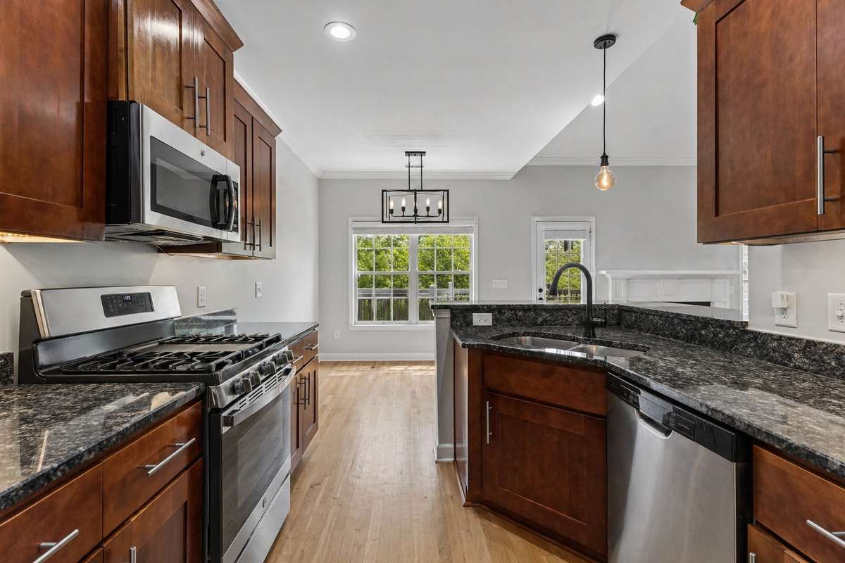 Another view of your kitchen with gas cooktop, ample cabinet storage & hardwood flooring. 1012 Rudder Drive, Spring Hill, TN 37174
