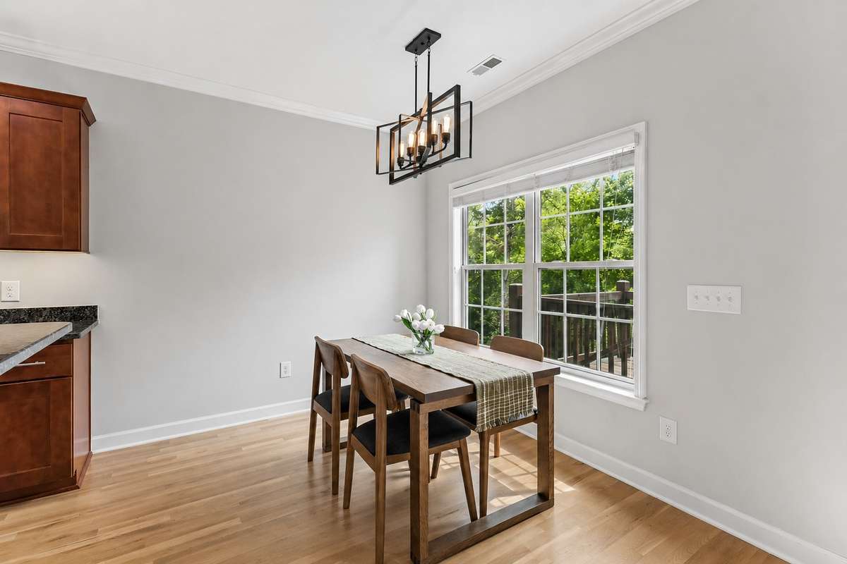 Eat in area with double window, modern chandelier & crown molding. 1012 Rudder Drive, Spring Hill, TN 37174