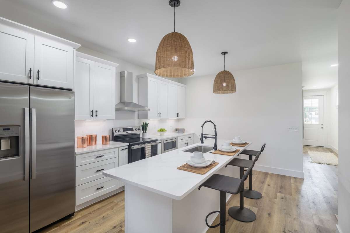 The kitchen opens up just beyond the entry way