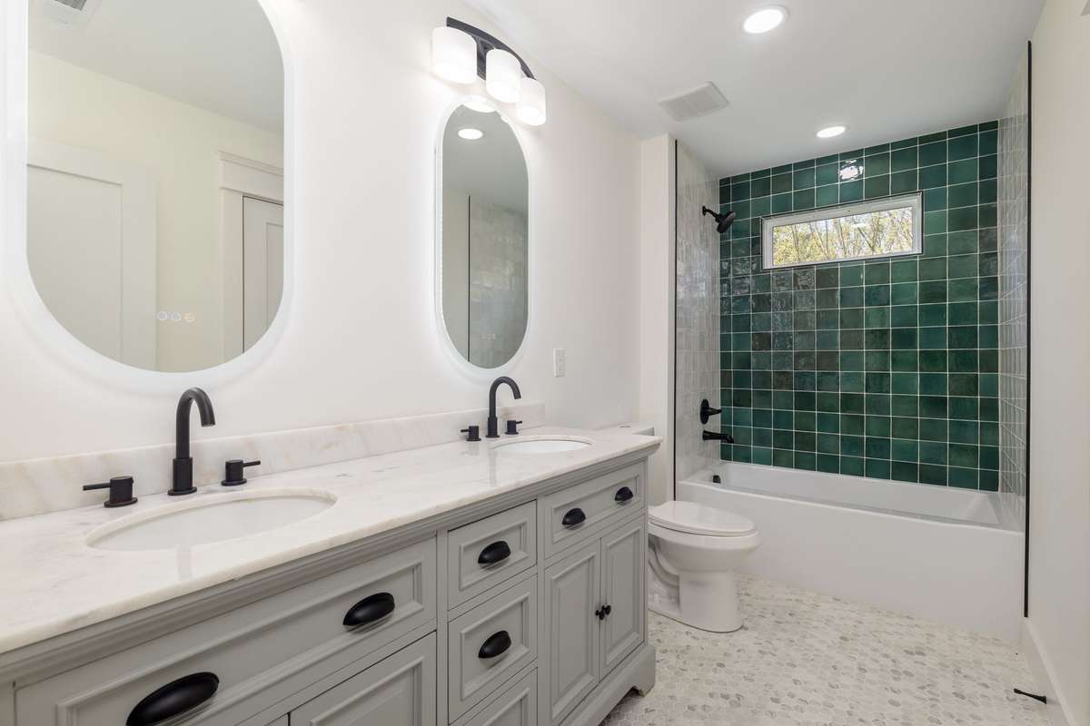 Second full bath upstairs with storage and full bath/shower combination.