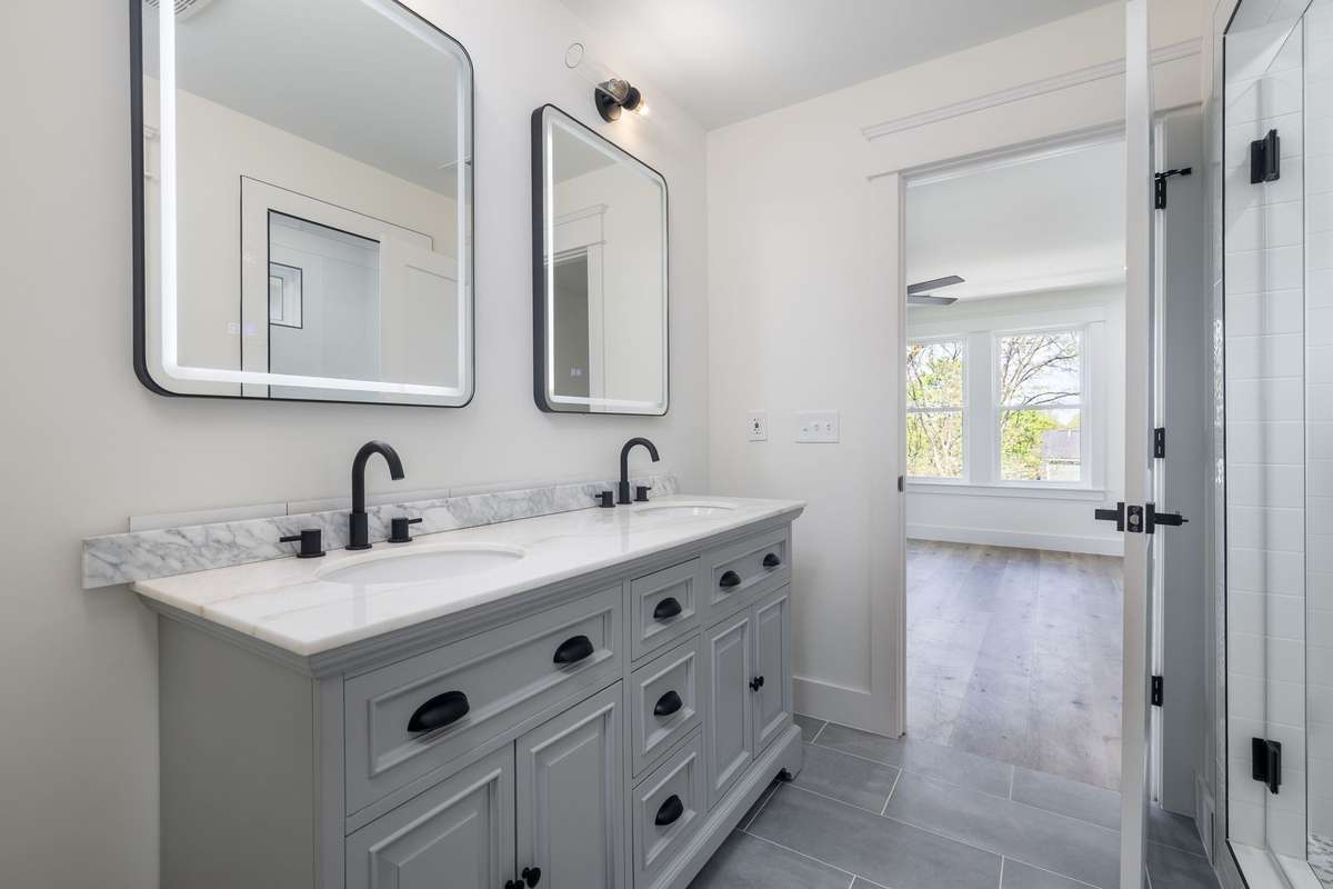 Primary en suite offers room for two and storage!