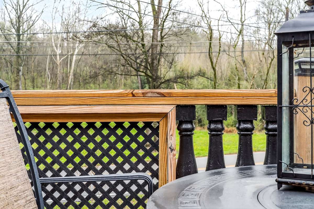 Deck furnishings remain. These antique balusters came off the Univ. of Kentucky and saved from a past renovation there. Also, the deck rails have mixed lattice