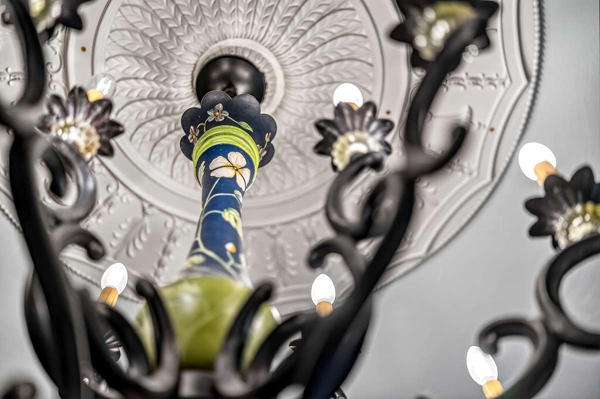 Antique chandelier in the open living room. This chandelier came out of a Swiss designed  1920's chalet on Lookout Mtn.