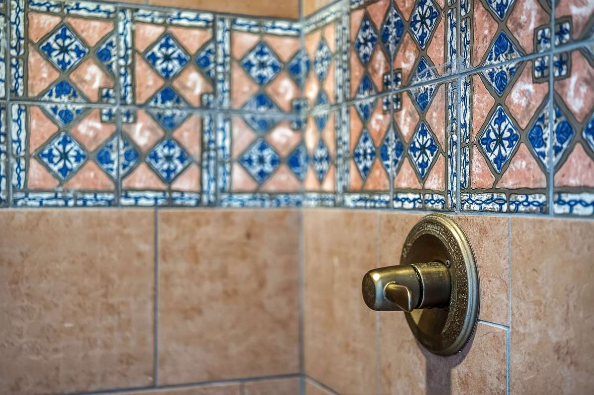 Old world Moroccan styled tiles in shower