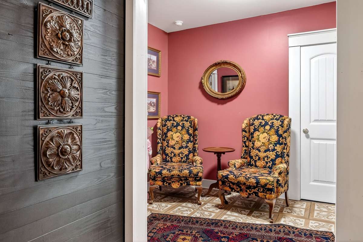 Back foyer area has a double door rear entrance (only 2 steps up). This entry features old iron doors. This foyer also features the St. Thomas knights cross porcelain tile.