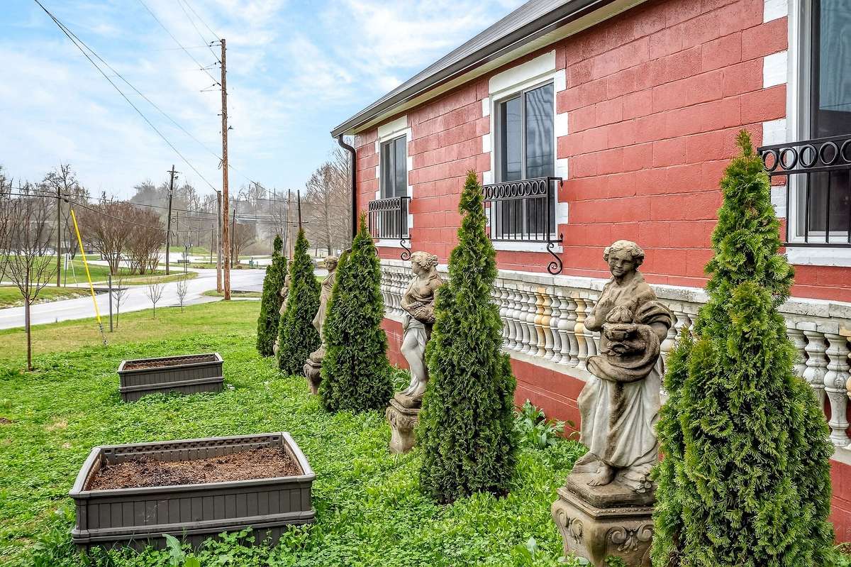 The outside curb appeal features architectural European stonework graced with beautiful Four Seasons lady statues.