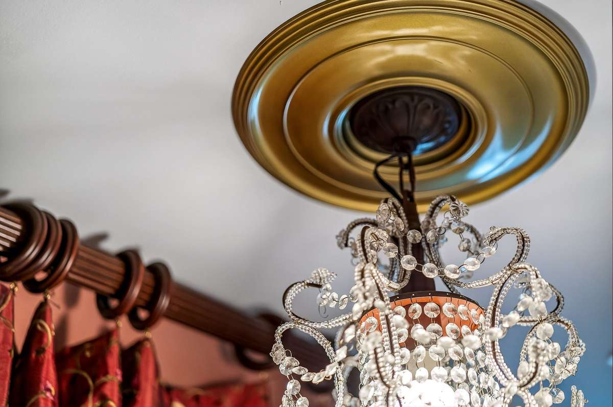 This gold leaf light fixture is in the guest bath.