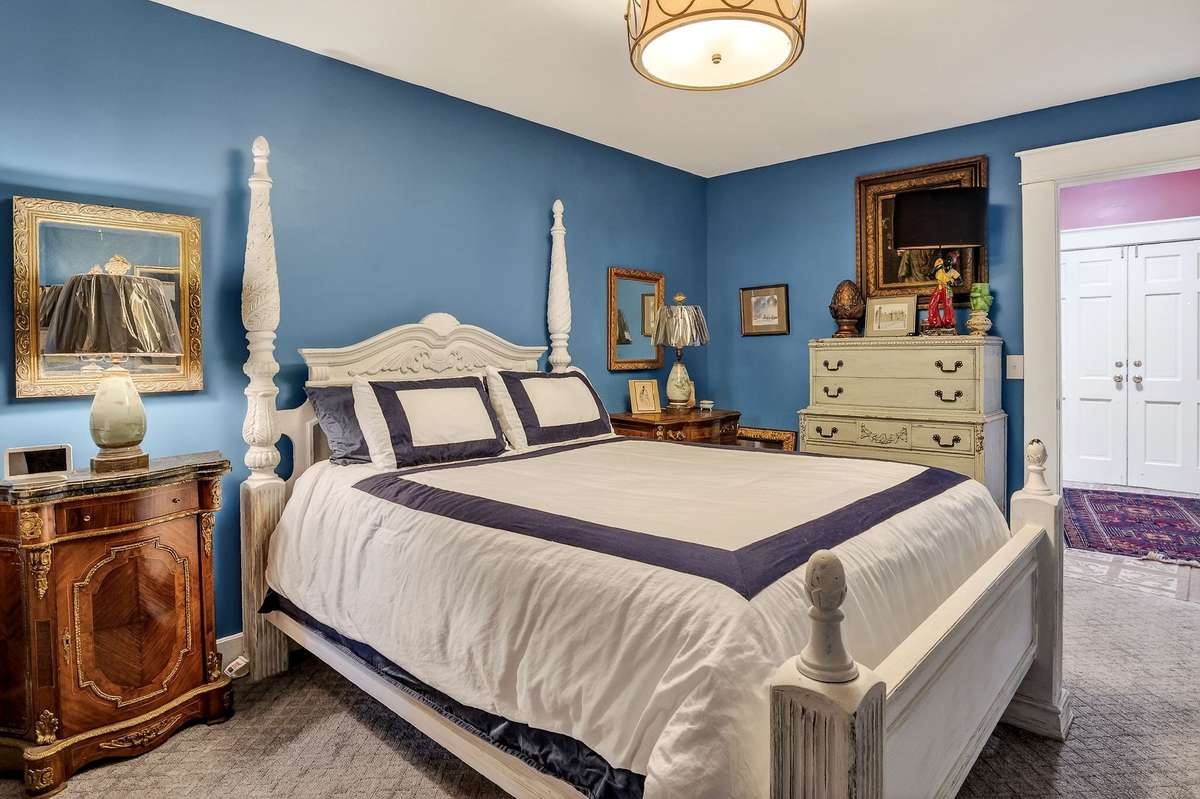 Guest bedroom looking toward back foyer and entrance.