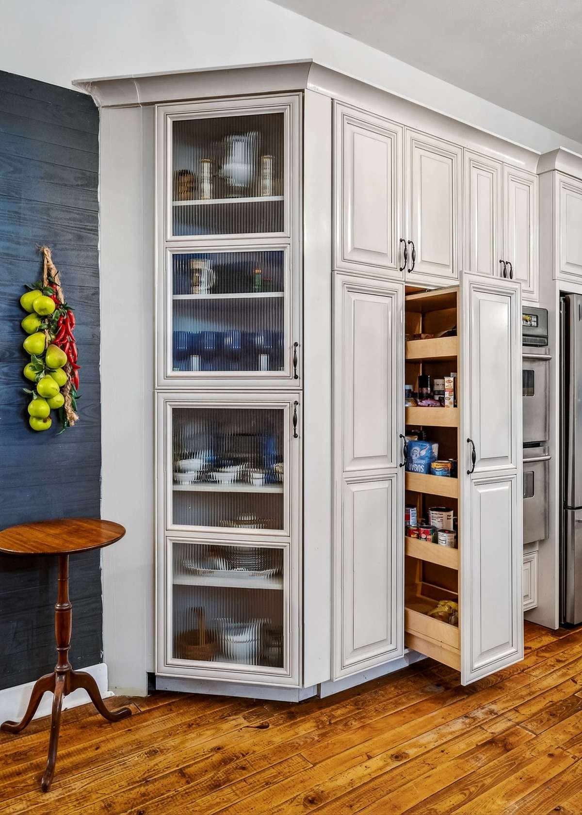 The glass front cabinets compliment the beauty of this kitchen.