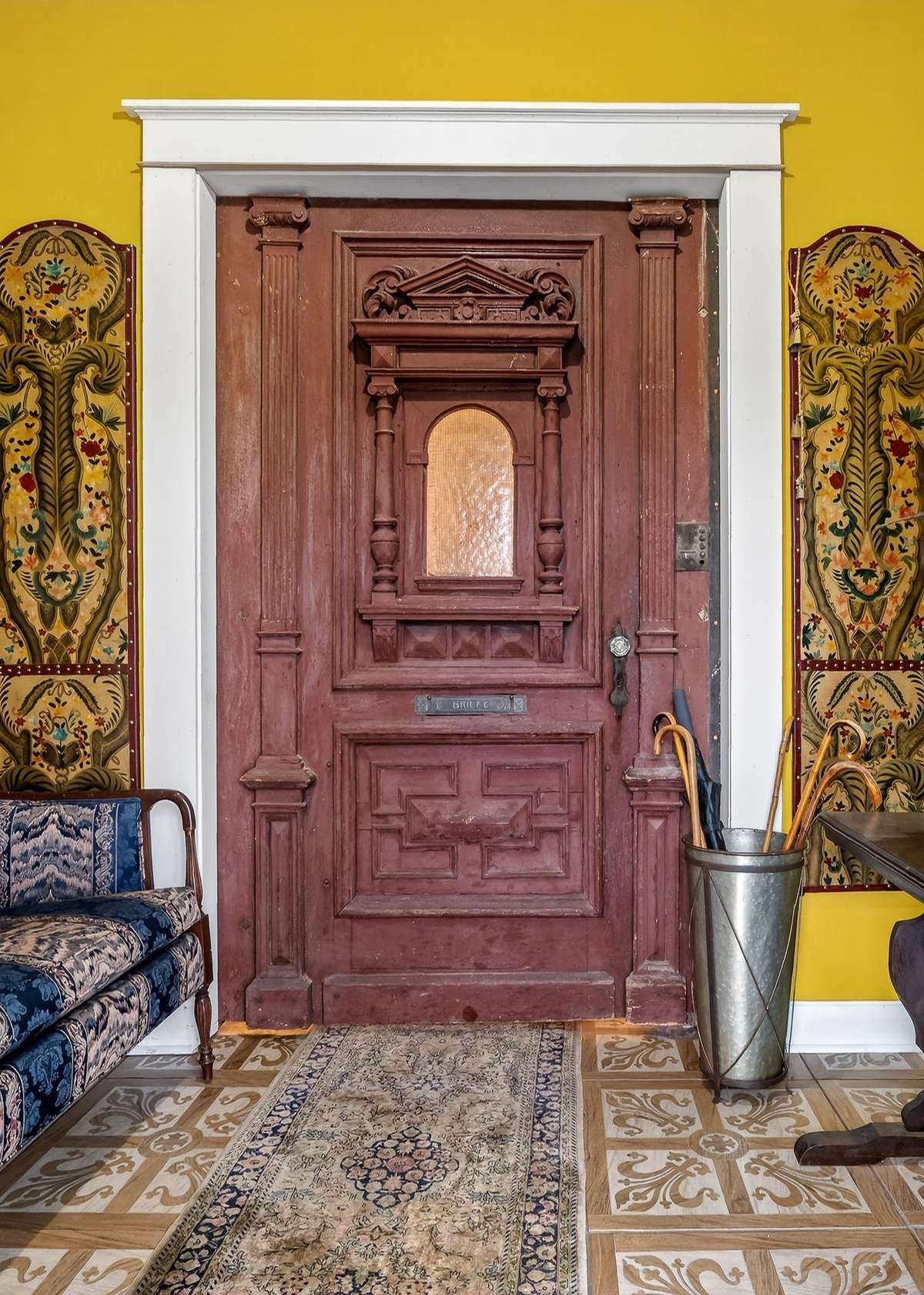 Inside the front door is this 9 x 5 foyer going into the main living space. This massive 94" x 54" grand door is from the New Orleans French quarter.  This foyer has a tall ceiling and bell glass shaped light fixture.