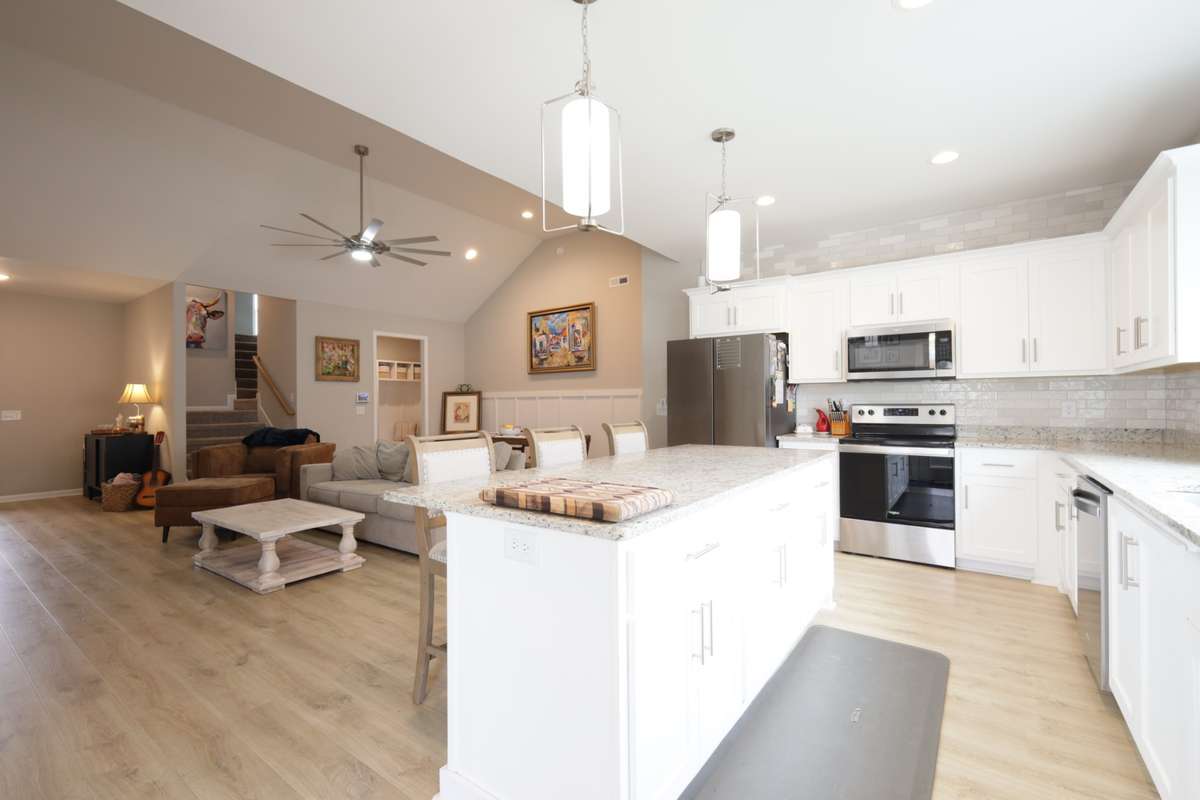 Custom backsplash from counter tops to ceiling was added to this spacious kitchen.