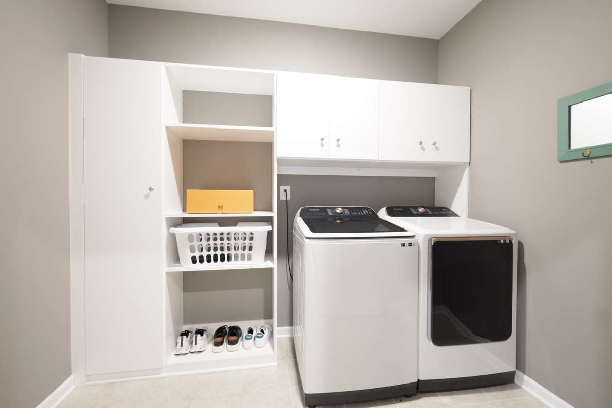 Separate laundry room with custom cabinetry was added here also.