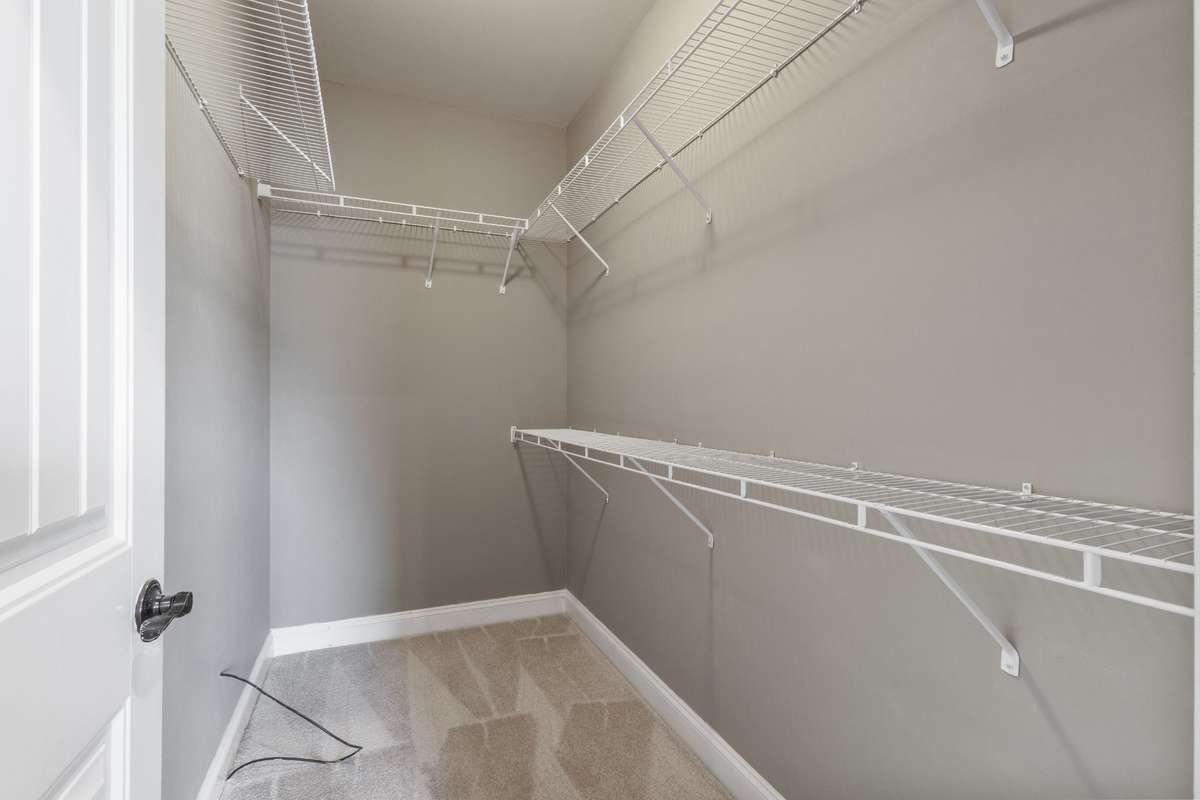 The versatile 4th bedroom retreat features a walk-in closet, making it perfect for a guest suite, teen retreat, or private home office