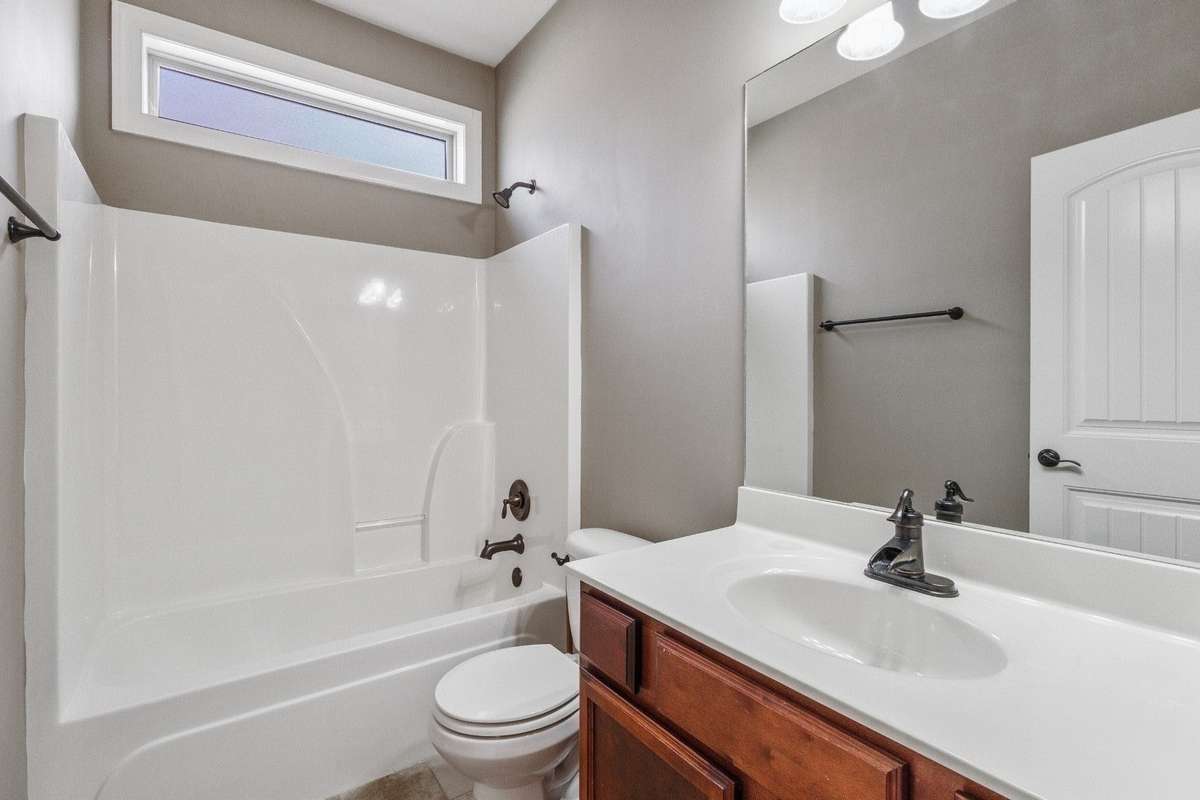Full bath on first floor accessible to guest and bedrooms 2 and 3.