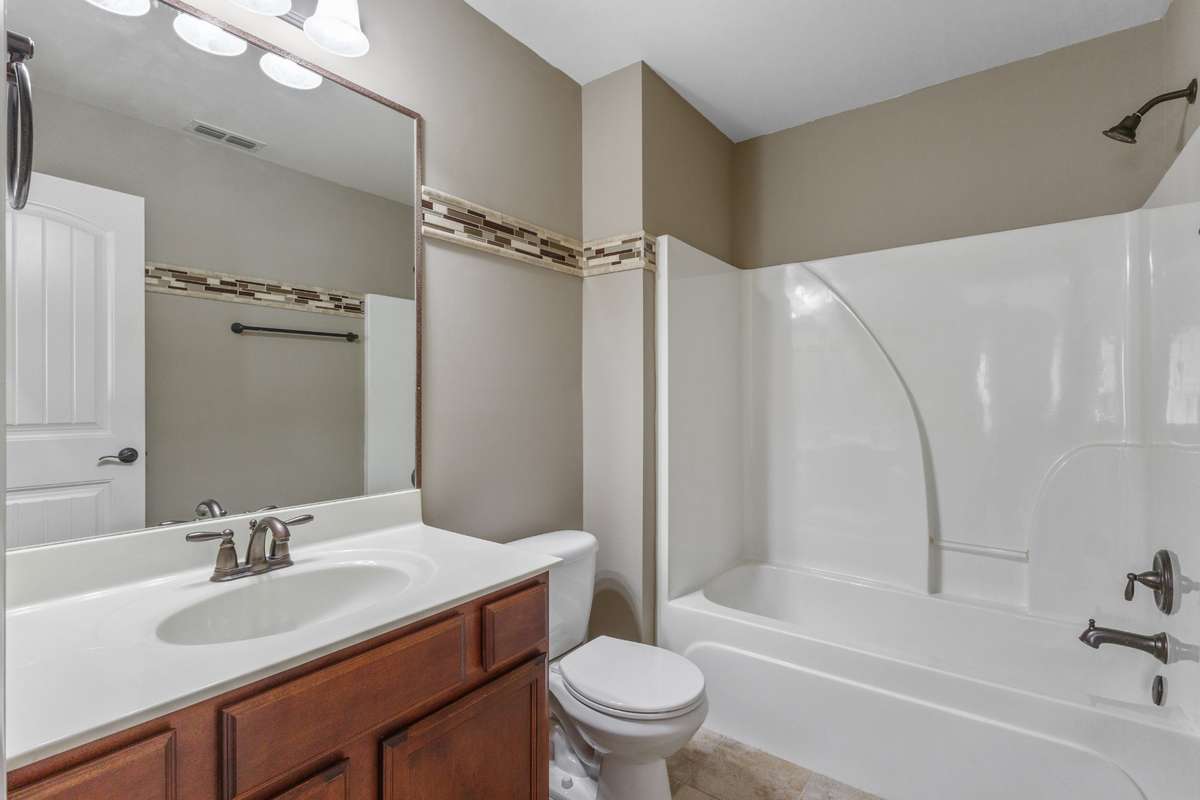 Upstairs, the expansive 4th bedroom retreat/bonus room is complemented by a full bath, creating a comfortable and private space ideal for guests, entertainment, or a personal getaway
