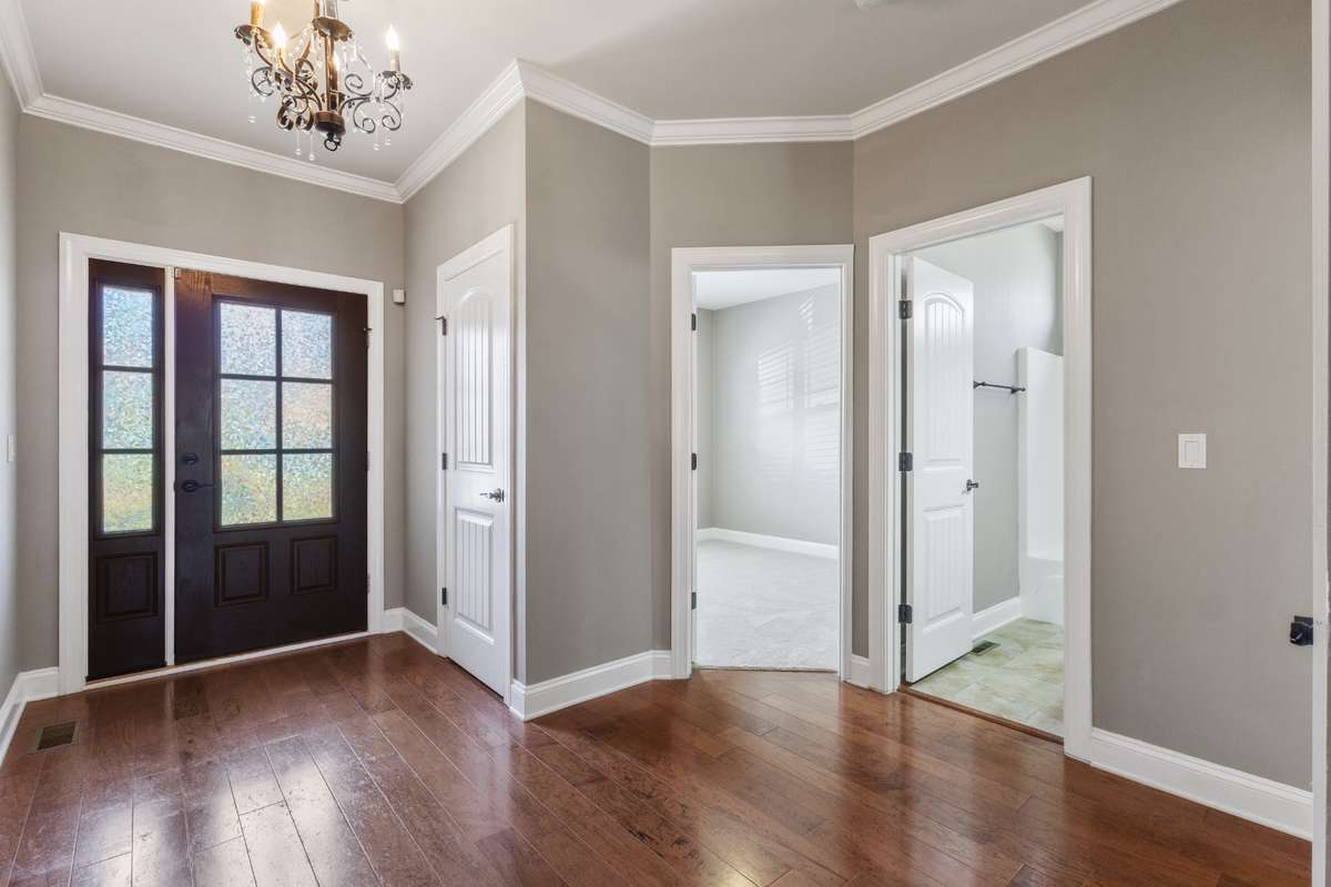 Your journey home begins on warm, inviting hardwood floors that welcome you inside. Guest bedroom or office  with full bath await you as explore the opportunities this home offers.