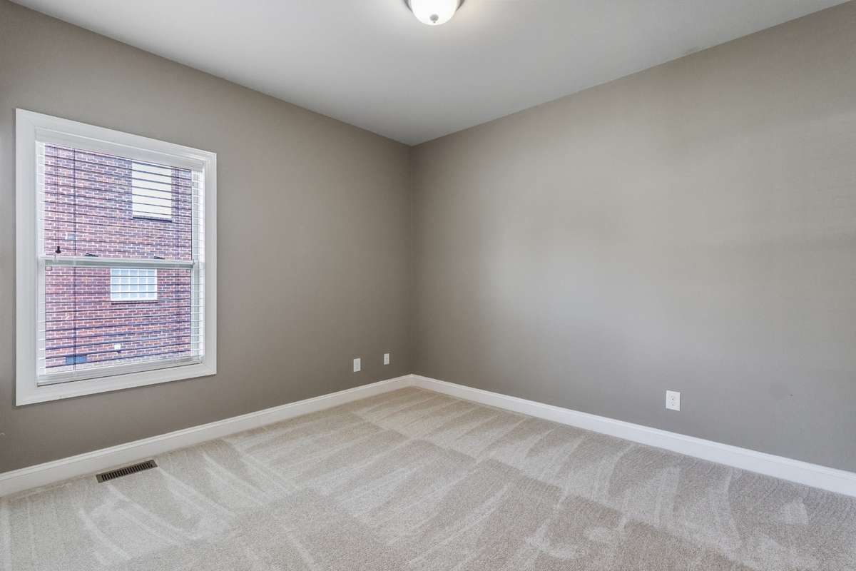 2nd bedroom on 1st floor on main level with ample room to retire with walk in  closet space.