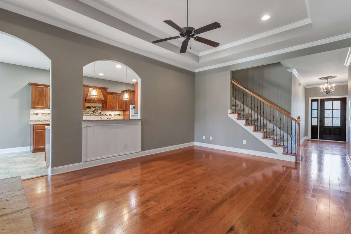 Arched entry and trey ceilings capture the openness of this layout