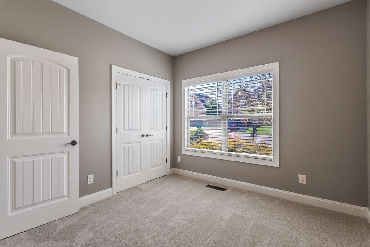 2nd bedroom on main level, ideal for guest, family or office with picturesque view to front of home.