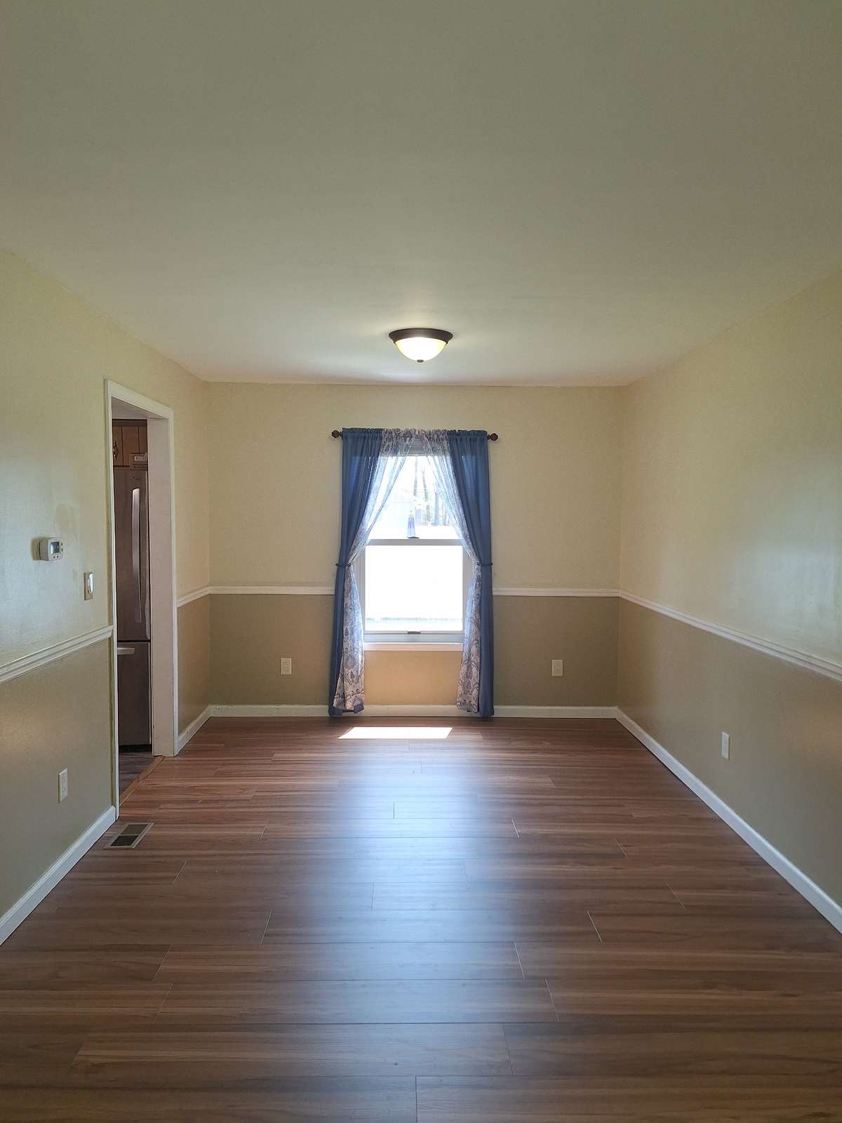 This formal dining area just off the kitchen adds to the space where you can gather for a family meal!!