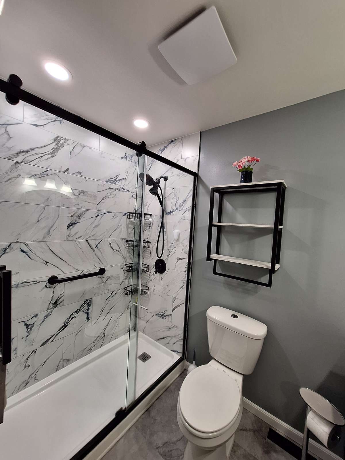 What a WOW factor!! Stylish walk-in shower with grab bars already in place!!