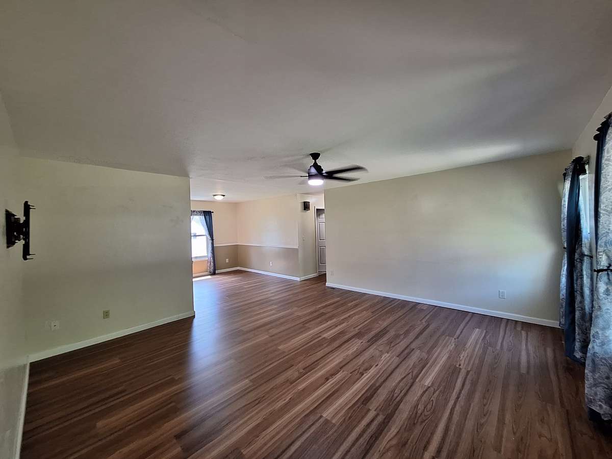 Welcome In!! Take a look at the beautiful LVP flooring in the spacious living room!!