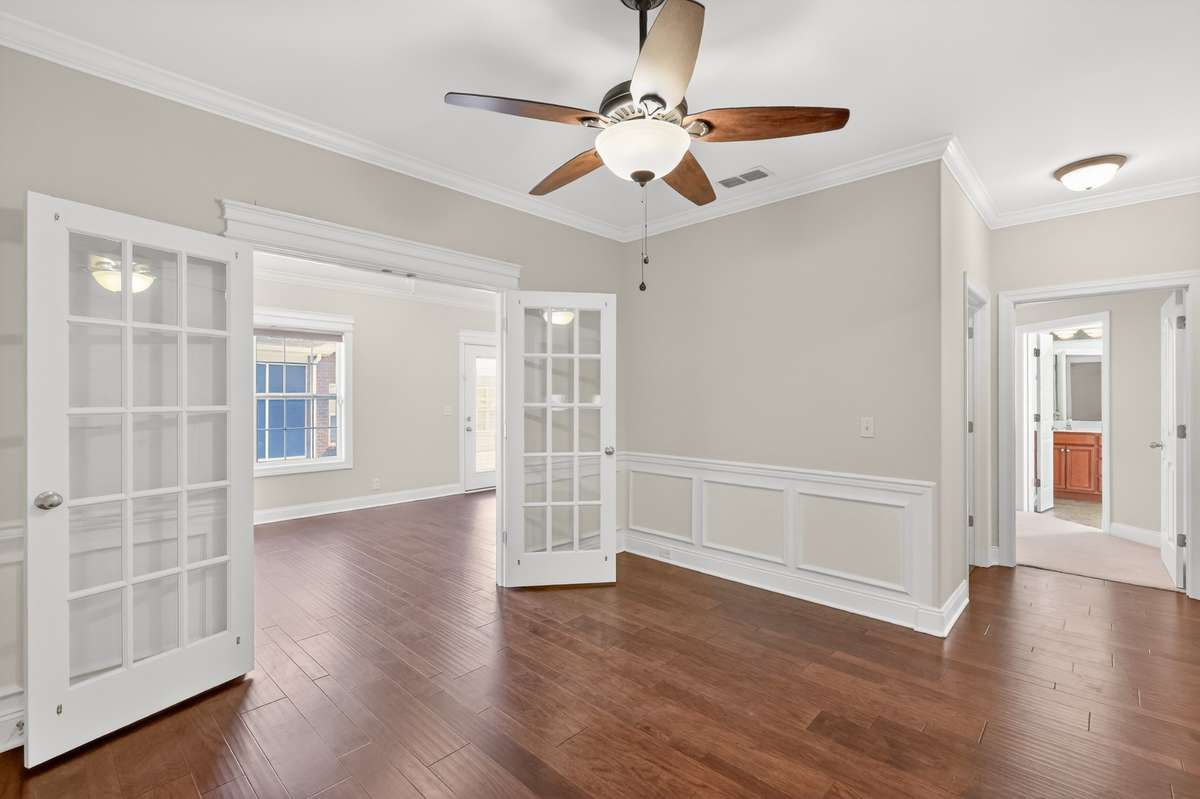 Wainscotting in the Dining Area elegantly elevates the space.